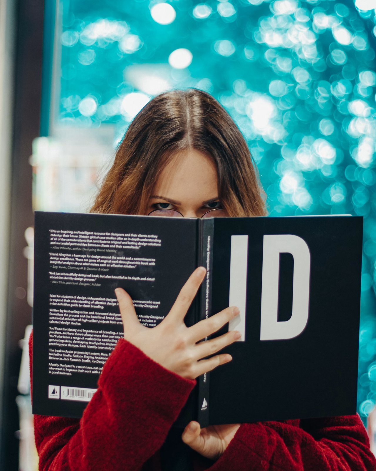 A person reading, focused, absorbed in a single book